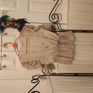 A peach silky polka dotted top